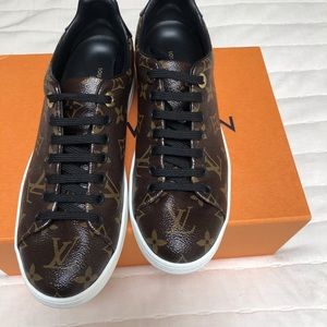 Louis Vuitton front row sneakers.